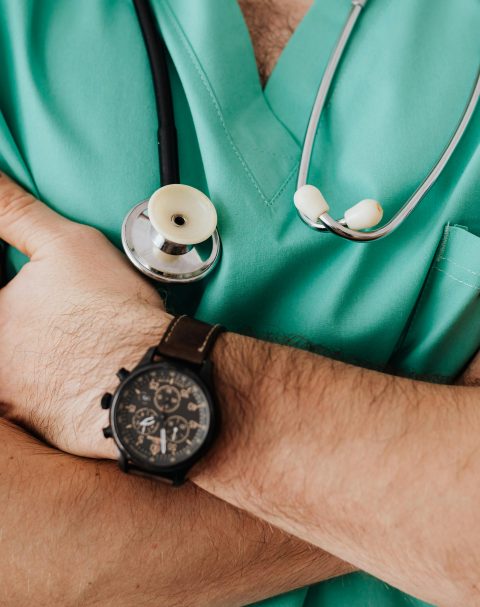 Close up of doctor with folded arms